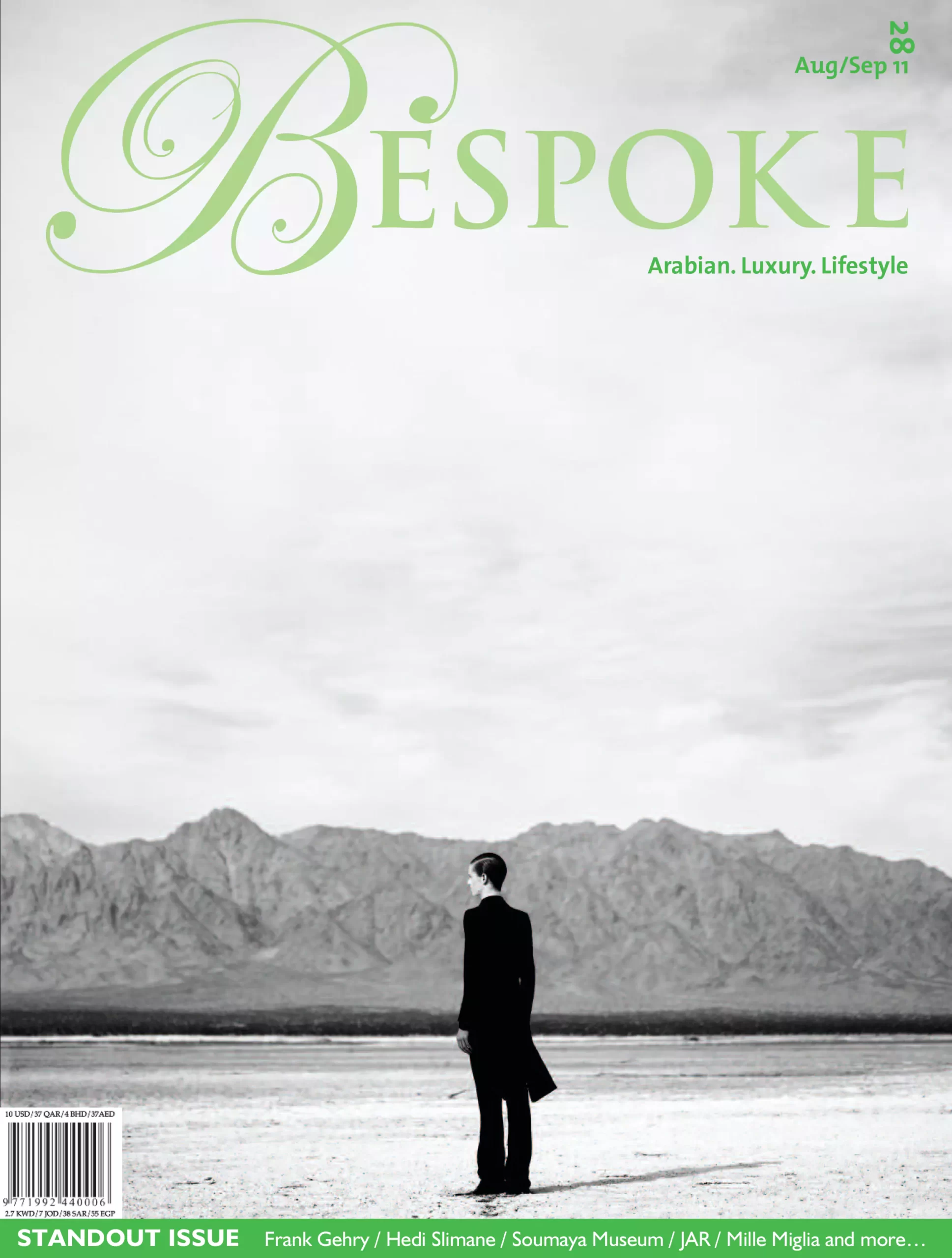 Cover of Bespoke Magazine August/September 2011 featuring a solitary figure in a desert landscape with mountain backdrop.